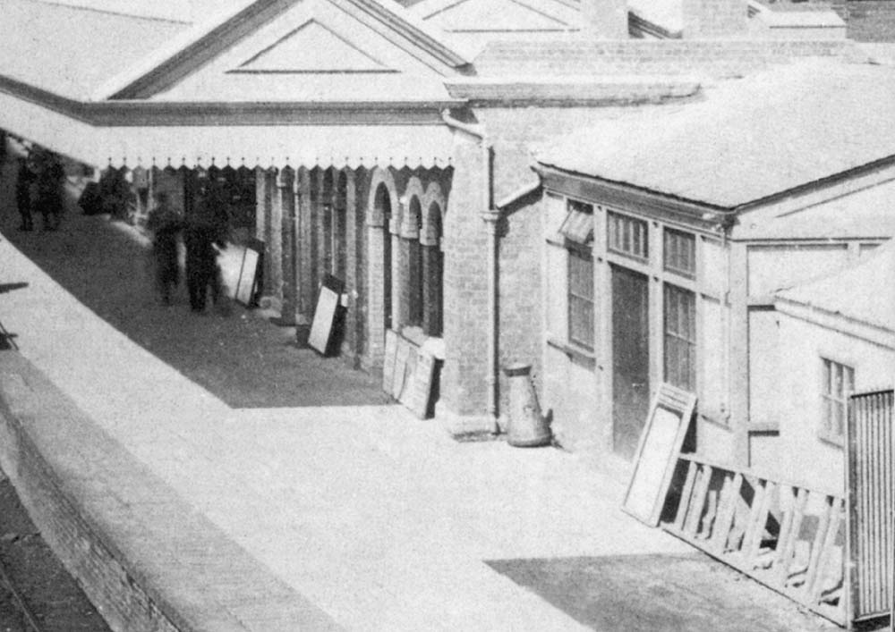 Close up of Stratford on Avon's down platform and upgraded and modified main station building with the new cycle shed seen on the right