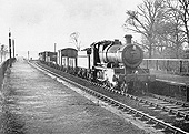 Ex-Great Western Railway 2-6-0 43xx class mogul No 6359 passes a desolate Stratford-on-Avon Racecourse Platform in January 1959