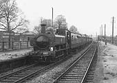 Restored to GWR livery 0-6-0PT 64xx class No 6435 is seen standing at the racecourse up platform whilst on a SLS special on 24th April 1965