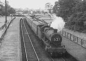 Ex-Great Western Railway 2-6-0 43xx class mogul No 6359 passes a desolate Stratford-on-Avon Racecourse Platform in January 1959