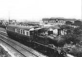 GWR 0-4-2T 14xx Class No 4825, with auto-coach attached, is seen passing under the SMJ bridge in 1933