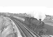 Ex-GWR 4-6-0 Hall class No 6948 'Holbrooke Hall' is seen on an evening Birmingham to Worcester service