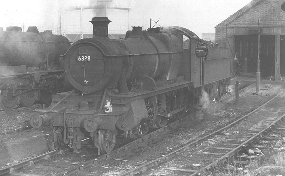 Ex-GWR 2-6-0 No 6338 stands in front of the shed alongside Austerity No 90483 on 5th January 1960