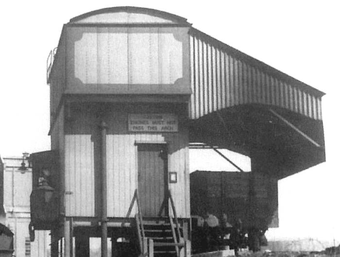 Close up showing the side of the combined coaling stage and water tank with a wagon placed to coal the next engine