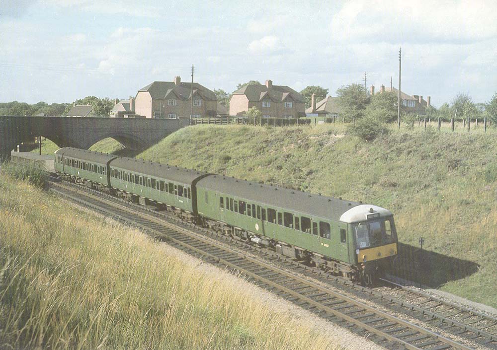 View of a three-car DMU forming the 4 15pm Moor Street to Henley in Arden departing from The Lakes Halt on 25th August 1962
