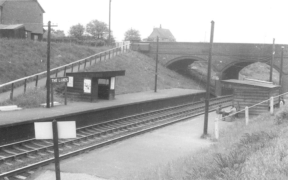 Looking in the direction of Stratford upon Avon across to the down platform with its simple waiting room and Malthouse Lane road bridge the background