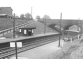 Looking towards Stratford upon Avon across to the down platform with its simple waiting room and Malthouse Lane road bridge