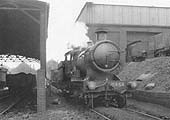 GWR 4-4-0 Bulldog class No 3454 'Skylark' is seen standing alongside Tyseleys two-road coaling station