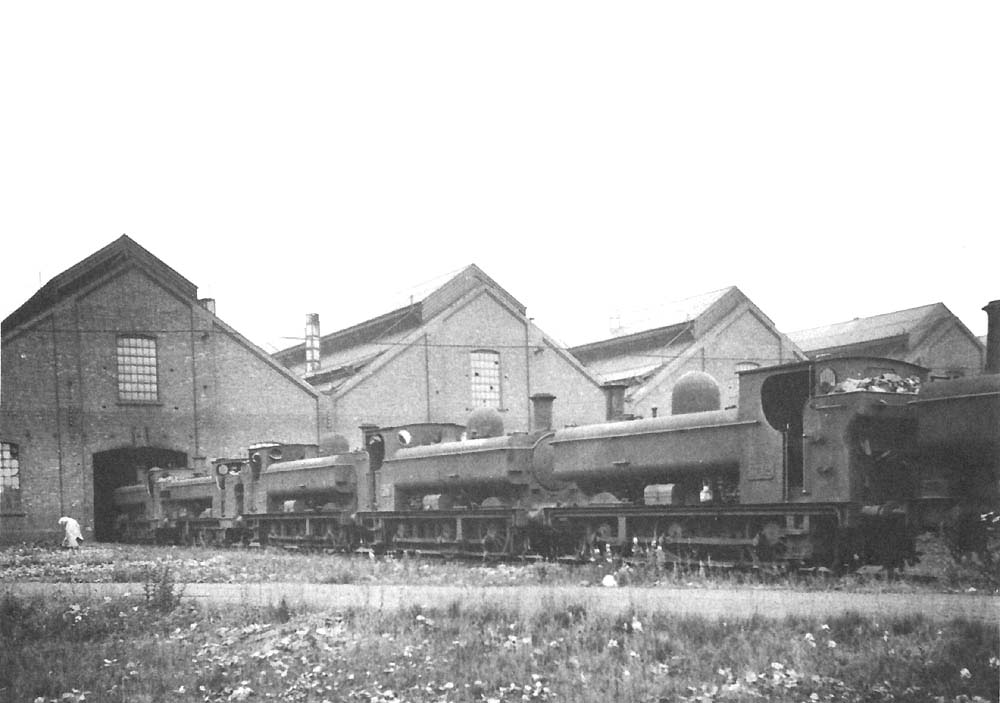 View of a row of GWR 0-6-0PT Pannier Tanks standing on the approach road to one of the two Tyseley shed's roundhouses in July 1939