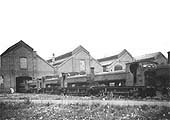 View of a row of GWR 0-6-0PT Pannier Tanks standing on the approach road to one of the two Tyseley shed's roundhouses