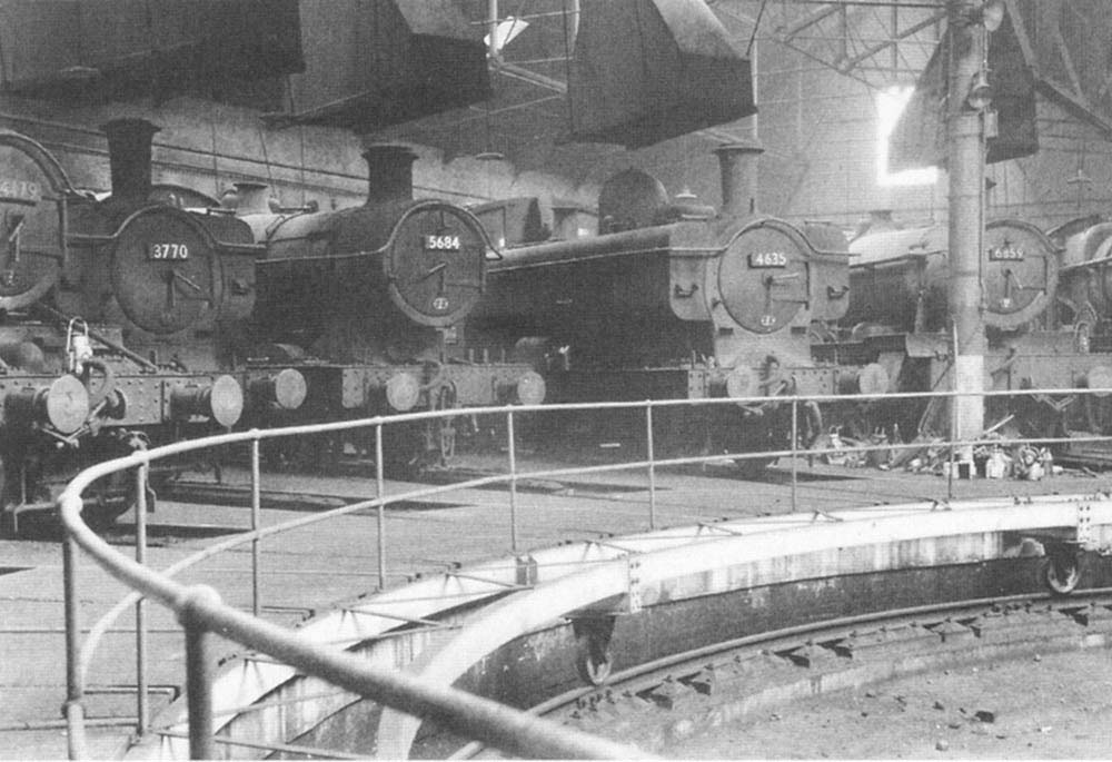 An internal view of one of Tyseley shed's two roundhouses with a variety of ex-GWR locomotives on display on 22nd November 1964