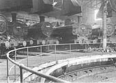 An internal view of one of Tyseley shed's two roundhouses with a variety of ex-GWR locomotives on display on 22nd November 1964
