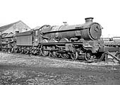 BR built 4-6-0 Castle Class No 7014 'Caerhays Castle' is standing in line on Tyseley shed's scrap line on 31st January 1965