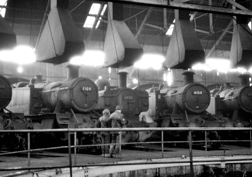 Ex-GWR 2-6-2T 81xx Class No 8109, ex-GWR 0-6-0PT 57xx Class No 3770 and ex-GWR 2-6-2T 5101 Class No 4158 are seen stabled inside Tyseley shed on 31st January 1965