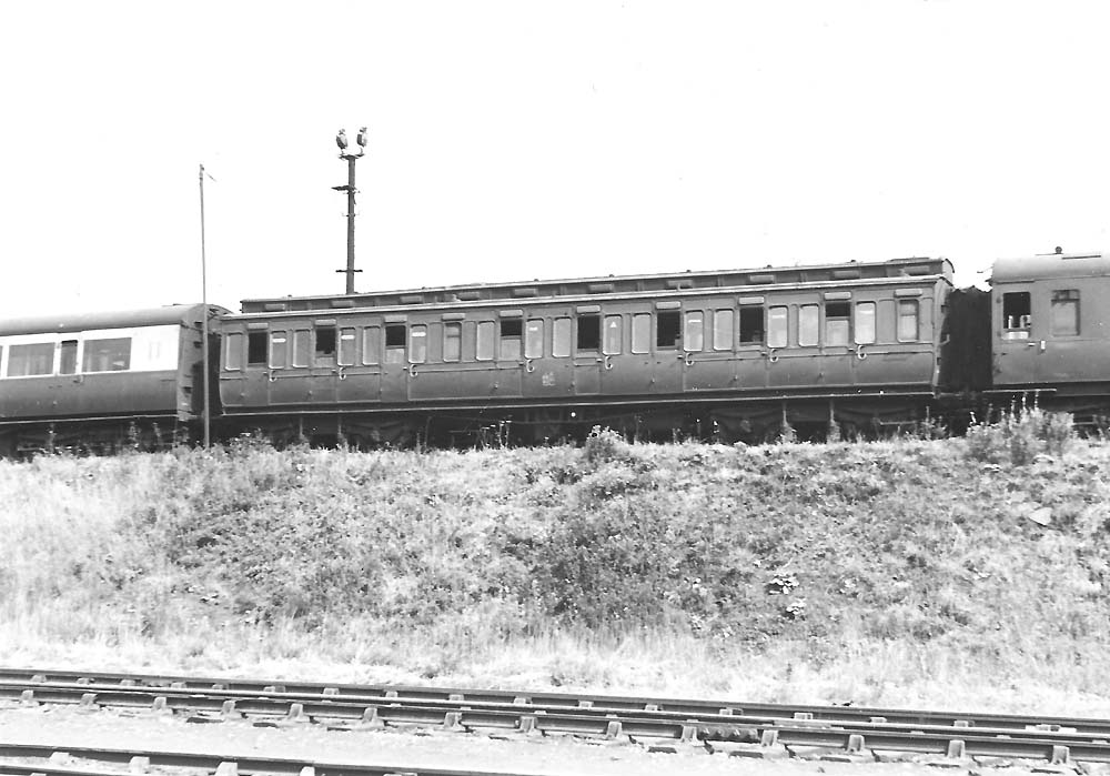 A 53 foot long corridor third class clerestory coach, No 2836, on the bank at Tyseley in July 1947