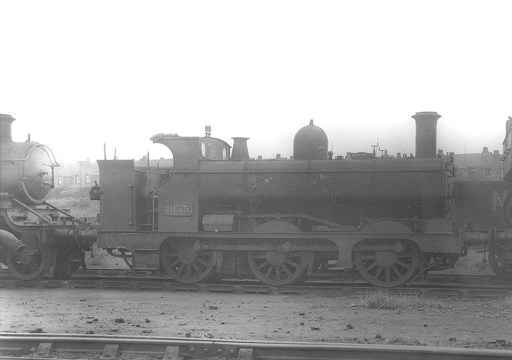 GWR 0-6-0PT No 1955, a half-cab class 850 locomotive, is seen standing in line outside Tyseley shed circa 1932