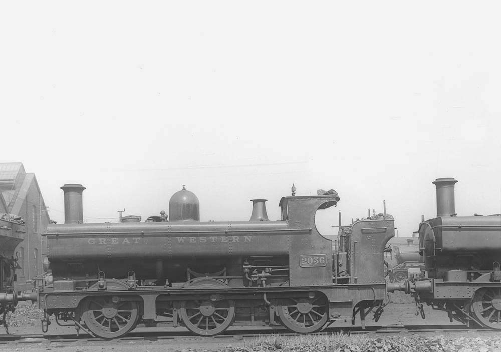 GWR 0-6-0PT No 2036, a member of the 2021 class fitted with a half-cab, is seen standing in line outside Tyseley's roundhouses
