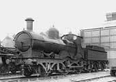 GWR 2-4-0 Barnum class No 3210, a curved outside-framed locomotive, stands outside Tyseley's Repair shops