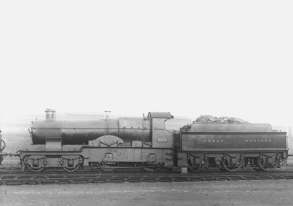 GWR 4-4-0 Bulldog class No 3450 'Peacock', an outside-framed locomotive, stands in Tyseley shed's yard ready for service