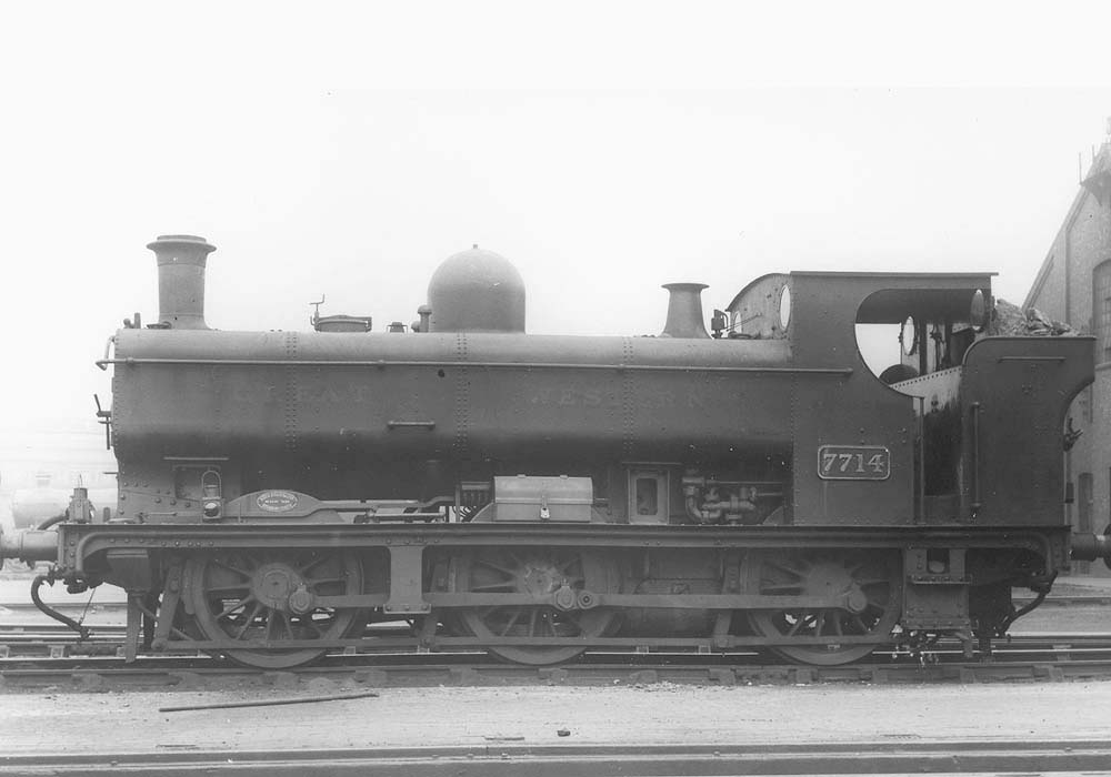 GWR 0-6-0PT No 7714, a class 57xx full-cab locomotive, is seen standing in line in front of Tyseley shed