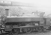 GWR 0-6-0PT No 2104, a half-cab class 2021 design, is standing near the carriage sidings in line with other locomotives