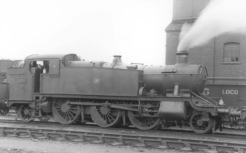 GWR 2-6-2T No 4110, a class 51xx 'Large Prairie' locomotive, is seen raising steam alongside Tyseley shed's two-road coaling stage