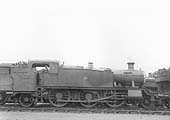 GWR No 4118, a class 51xx 'Large Prairie' locomotive, is seen in company with other locomotives waiting its turn to leave the shed