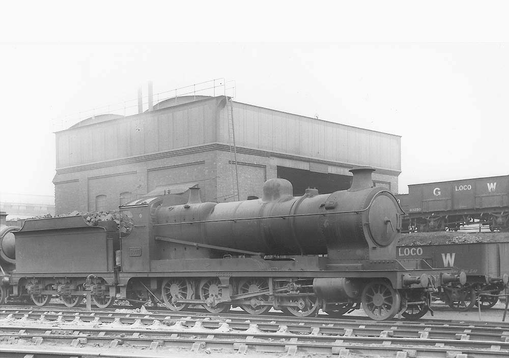 Ex-ROD 2-8-0 No 3037 is seen standing on the stabling roads fully coaled with Tyseley shed's two-road coaling stage in the background