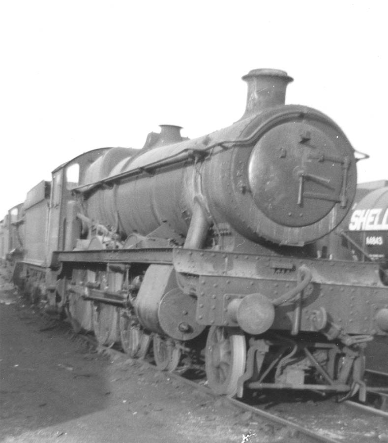 An unidentified ex-GWR Hall Class locomotive stands 'cold' in front of Tyseley shed on a Sunday in the early 1960s