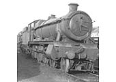 An unidentified ex-GWR Hall Class locomotive stands 'cold' in front of Tyseley shed on a Sunday in the early 1960s