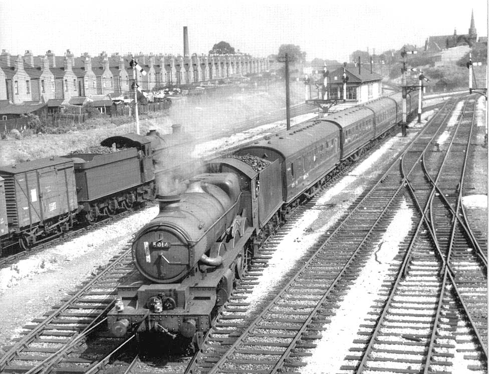 Ex-GWR 4-6-0 Castle class No 5014 'Goodrich Castle' is seen at the head of a down passenger service passing Tyseley South signal box