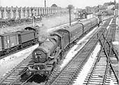 Ex-GWR 4-6-0 Castle class No 5014 'Goodrich Castle' is seen at the head of a down passenger service passing Tyseley South signal box