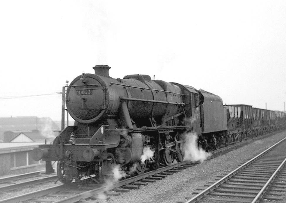 Ex-LMS 2-8-0 8F No 48133 is seen at the head of the 8 15 am Bilston to Banbury OIC ironstone empties train on 15th February 1965