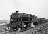Ex-LMS 2-8-0 8F No 48133 is seen at the head of the 8 15 am Bilston to Banbury OIC ironstone empties train on 15th February 1965
