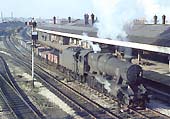 A very dirty ex-LMS 2-8-0 8F No 48385 has just restarted from signals as it heads an up London bound freight service on 6th November 1965