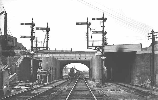 Looking towards Tyseley station as an up goods service approaches Stockfield Road bridge during it reconstruction in 1939-40