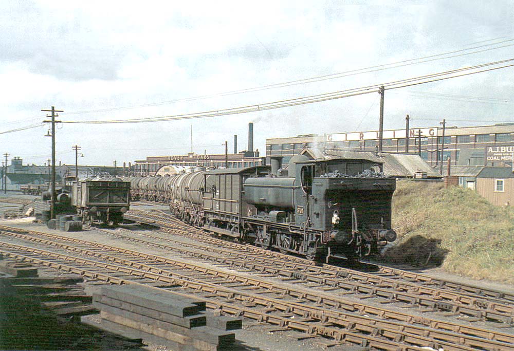 Ex-GWR 0-6-0PT No 8700 is seen shunting a rake of oil tank wagons into Tyseley goods yard's sidings in 1958