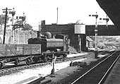Ex-GWR 0-6-0PT 57xx Class No 8737 is seen shunting a rake of wagons into Tyseley goods yard in the summer of 1959