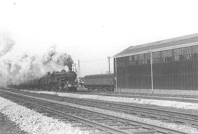 BR built 4-6-0 Castle class No 7013 'Bristol Castle' is seen at the head of a Birmingham to Paddington express on 6th April 1963