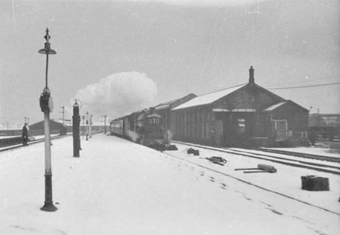 An unidentified ex-GWR 4-6-0 King class locomotive is seen on a snowy winter's day on what is thought to be the up 'Inter City' express train service