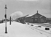 An unidentified ex-GWR 4-6-0 King class locomotive is seen on a snowy winter's day on what is thought to be the up 'Inter City' express train service