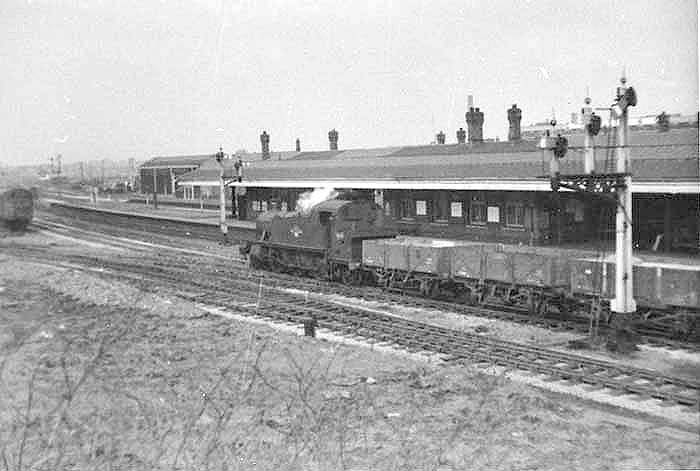 Ex-GWR 2-6-2T 'Prairie Tank' No 4133 at the head of a mineral train passes Tyseley station's down relief platform on the goods line to Moor Street