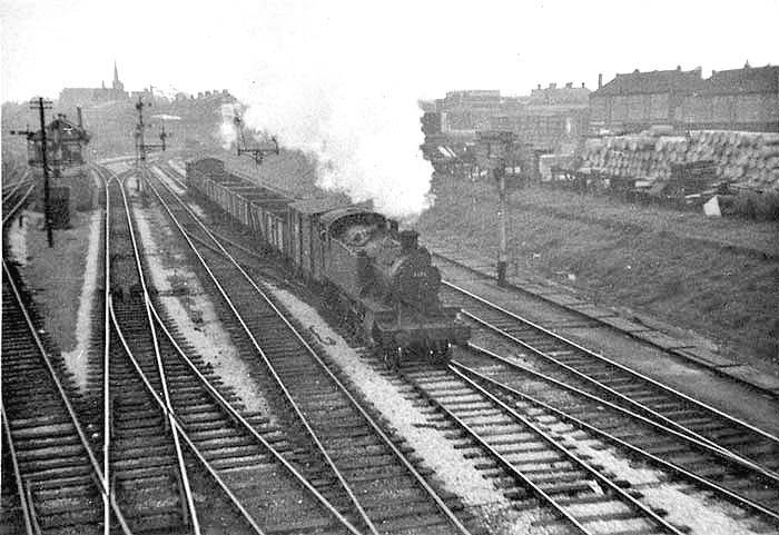 Looking towards Leamington as ex-GWR 2-6-2T 'Prairie Tank' No 4133 passes Tyseley South signal box on a down goods train circa 1963