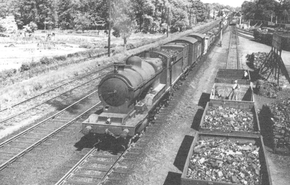 Great Western Railway 30xx Class 2-8-0 No 3026 passes by Cape Yard with a down goods train in 1938