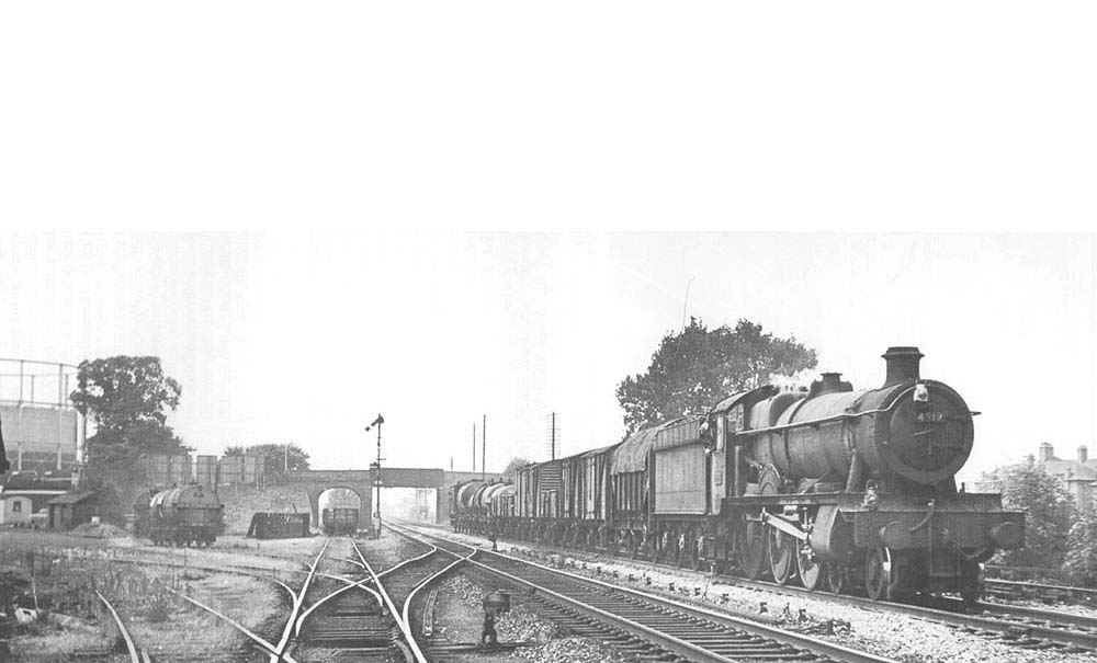 Ex-GWR Hall Class 4-6-0 No 4919 'Donnington Hall' on up main with Class D freight on 22nd July 1964