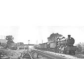 Ex-GWR Hall Class 4-6-0 No 4919 'Donnington Hall' on up main with Class D freight on 22nd July 1964