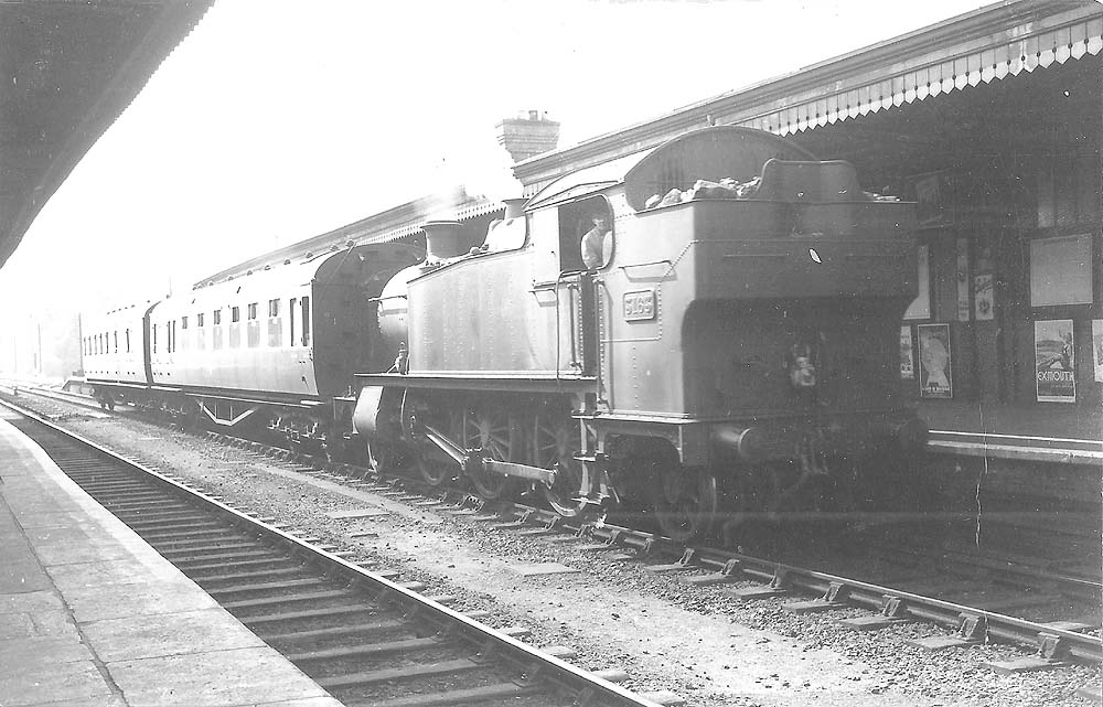 GWR 2-6-2T large prairie No 3163 with two ganged brake composite corridor coaches on an up local passenger train