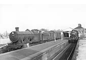 Ex-GWR 28xx Class 2-8-0 No 2822 runs through Warwick station at the head of an express goods train
