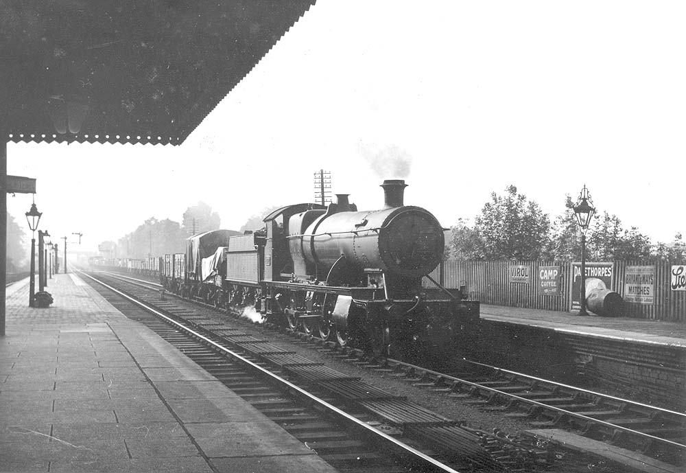 GWR 2-8-0 28xx class No 2872 pulls slowly out of the up refuge siding with a long class K freight train