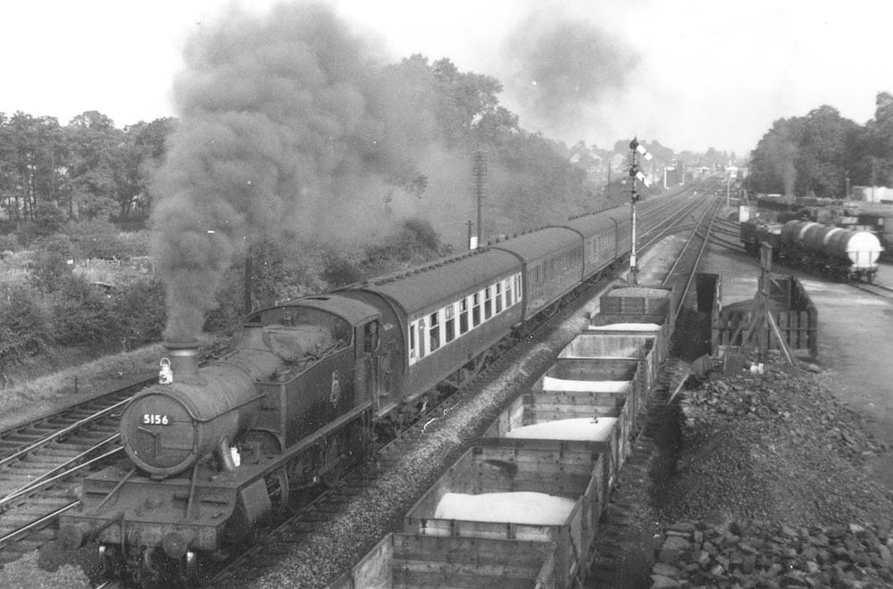Ex-GWR 2-6-2T Large Prairie No 5156 is seen at the head of a four-coach passenger service to Snow Hill as it passes Cape Yard north of the station